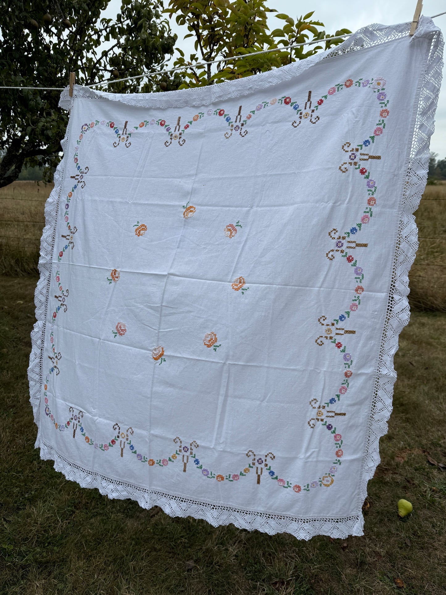 AA.multi colored cross stitch with crochet trim 47"x47"