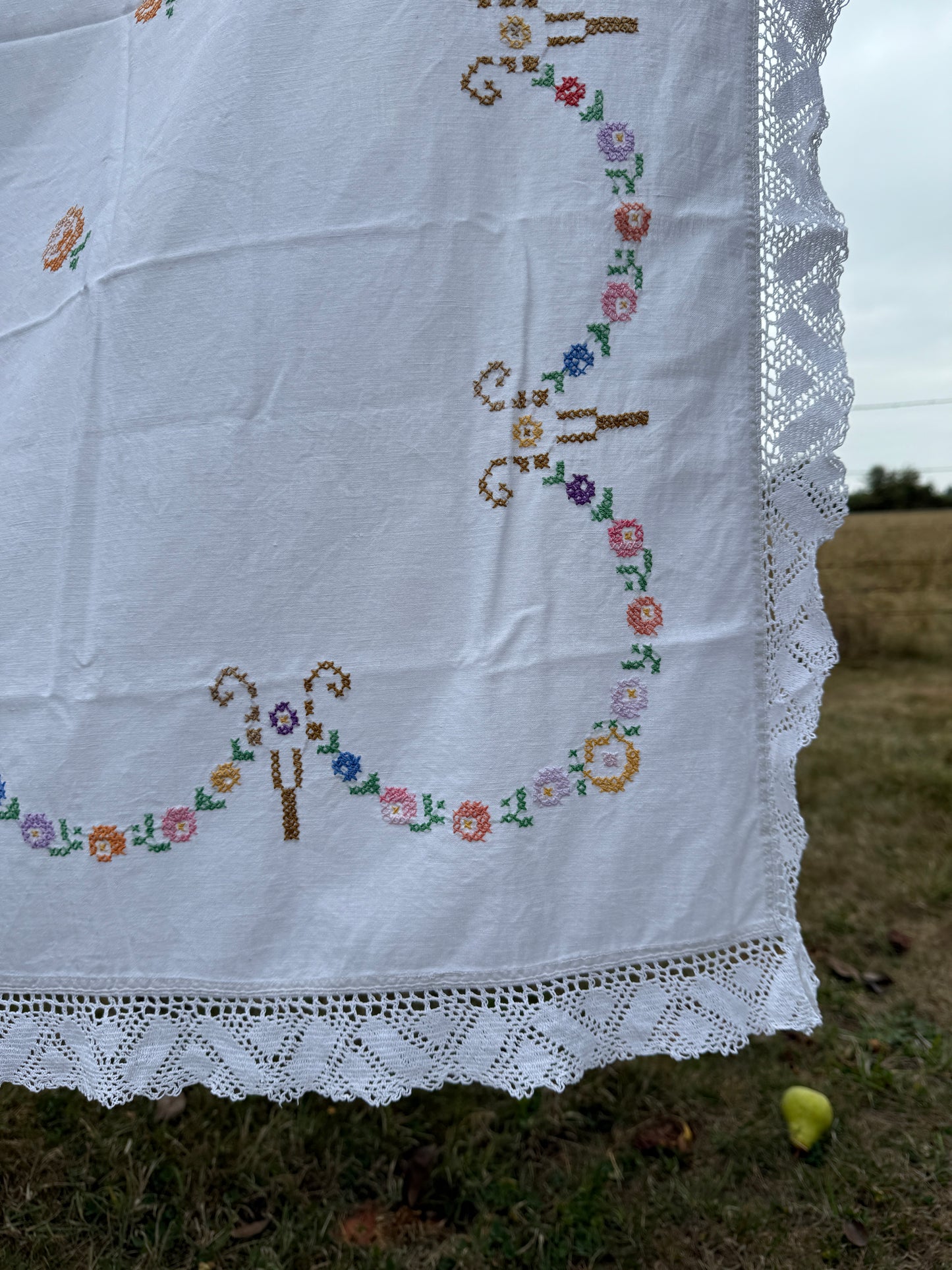 AA.multi colored cross stitch with crochet trim 47"x47"