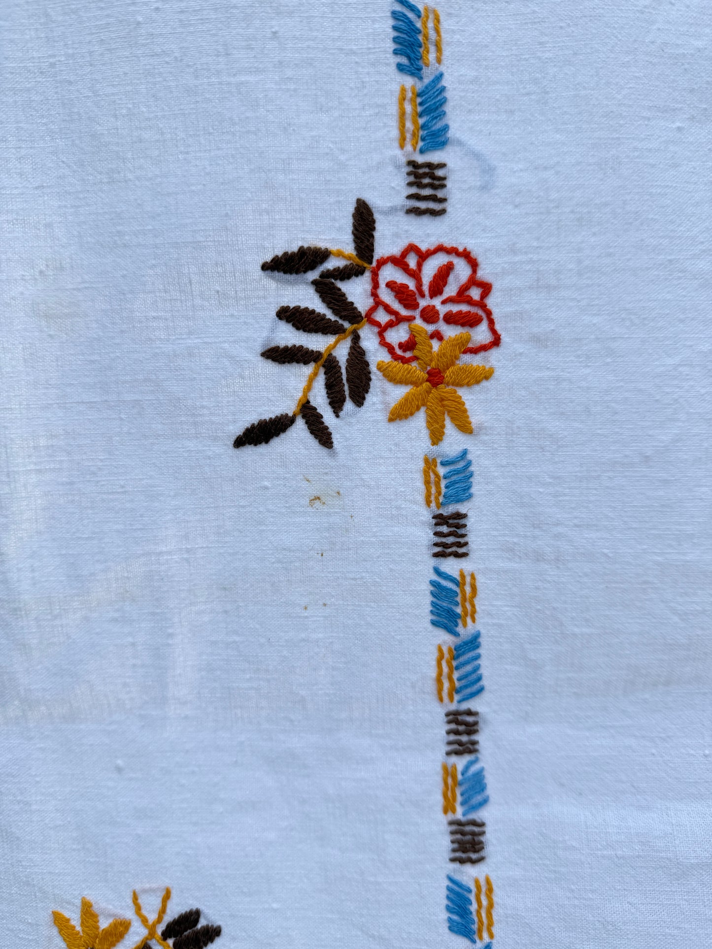 AA. red, blue, orange borders with crochet edging 60" x 51"