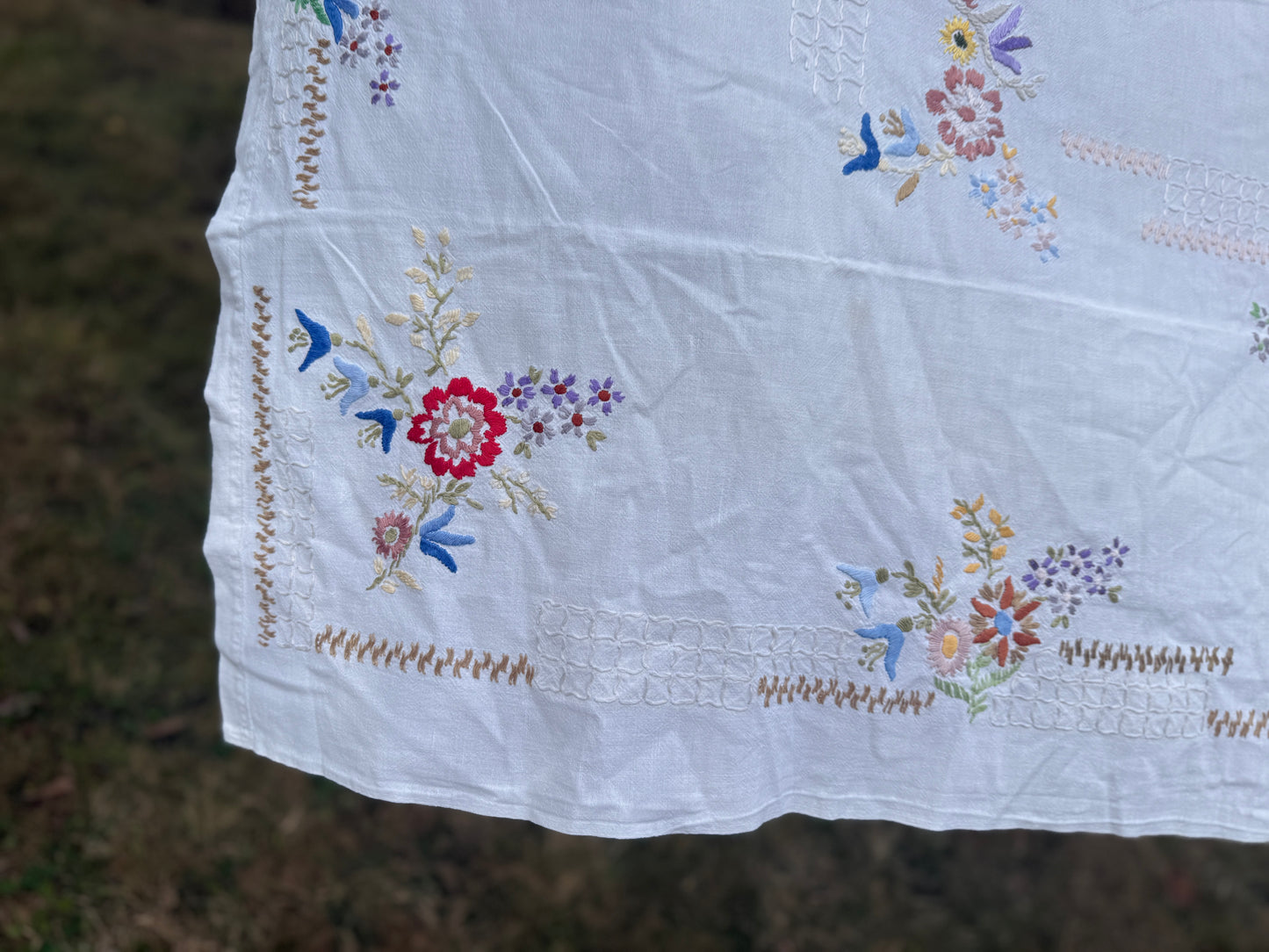 AA. Multi colored embroidered on soft canvas 45" x 52"