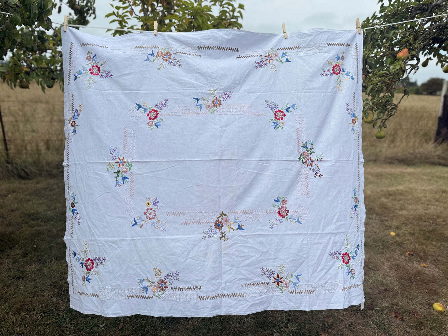 AA. Multi colored embroidered on soft canvas 45" x 52"