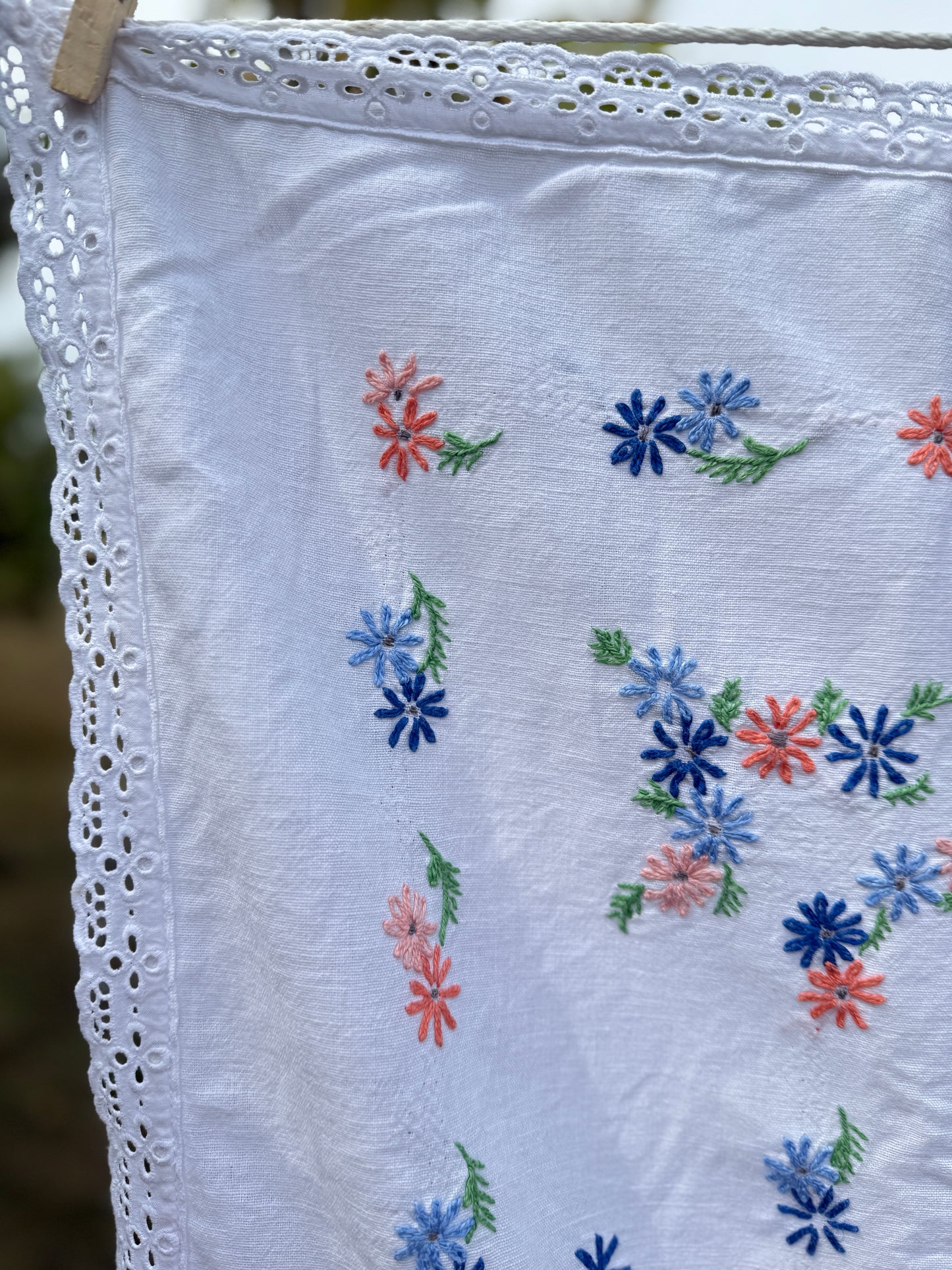 AA. peach and blue daisy embroidered with eyelet 47" x 58"