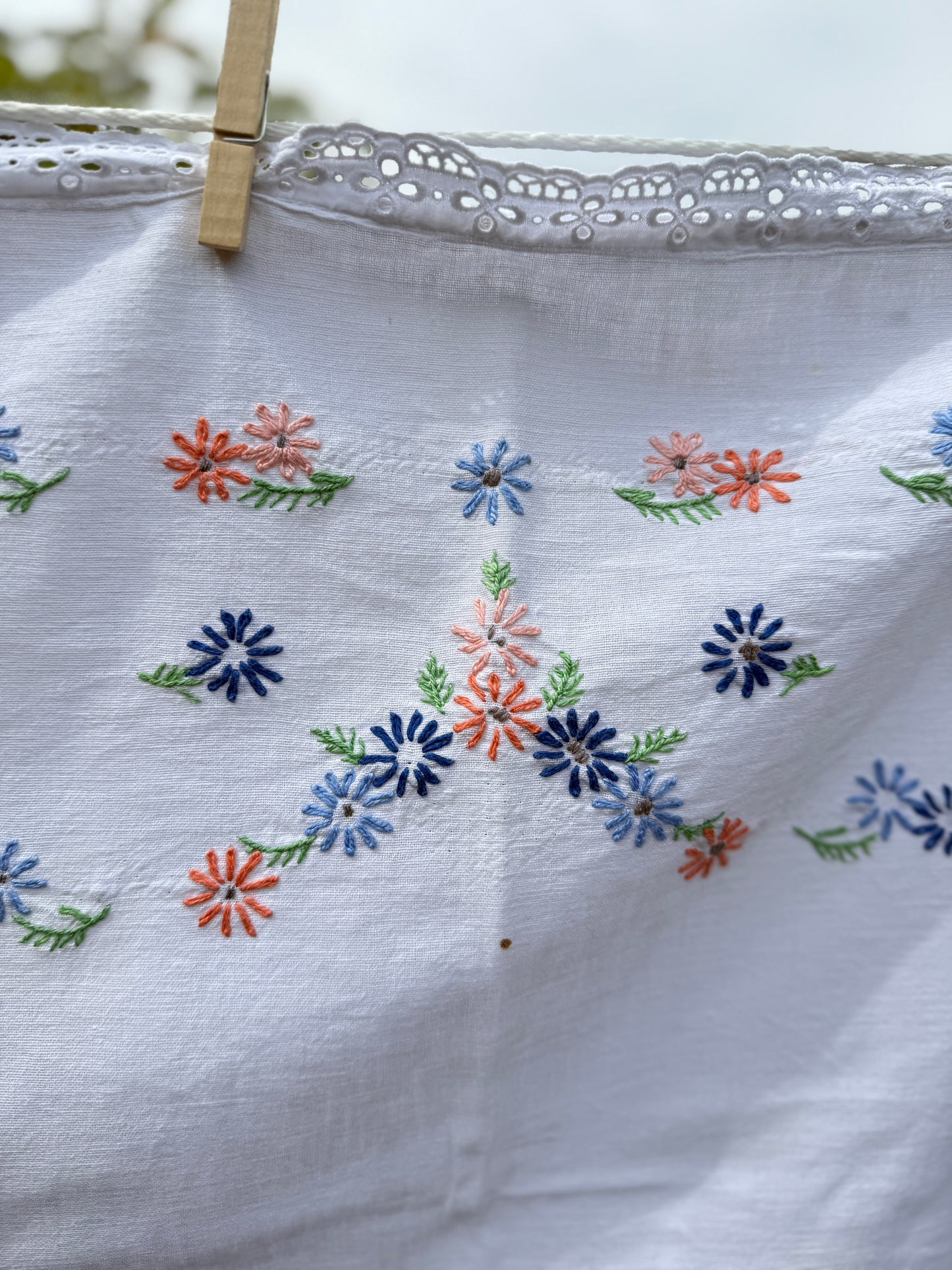 AA. peach and blue daisy embroidered with eyelet 47" x 58"