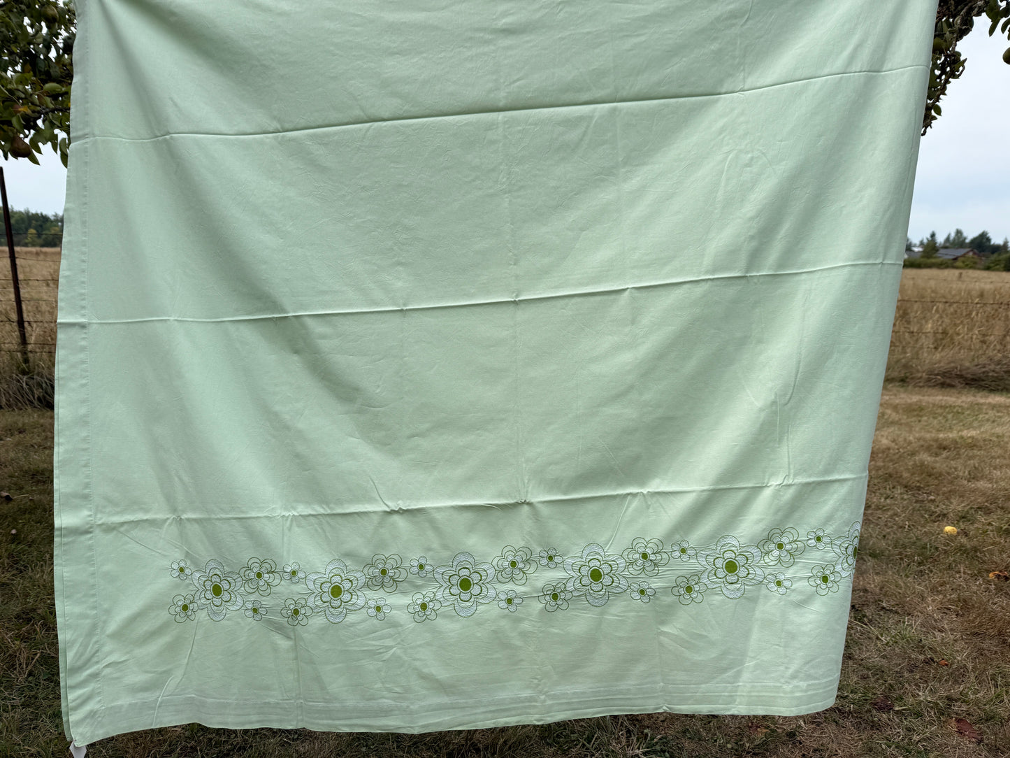 AA. Mint green sheet with daisy machine embroidery 55" x 97"
