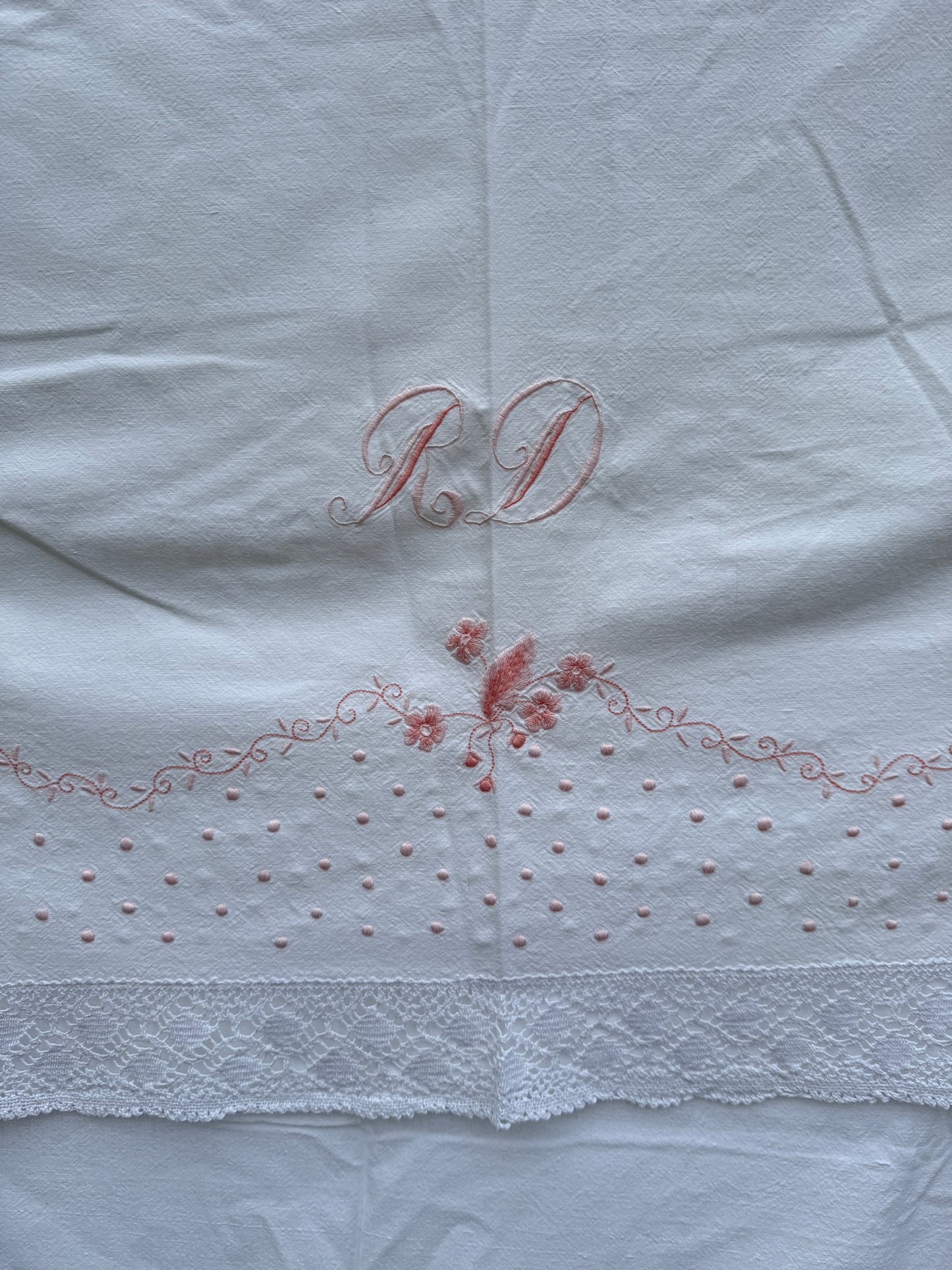 AA. Pink embroidered sheet with crochet trim 63" x 90"