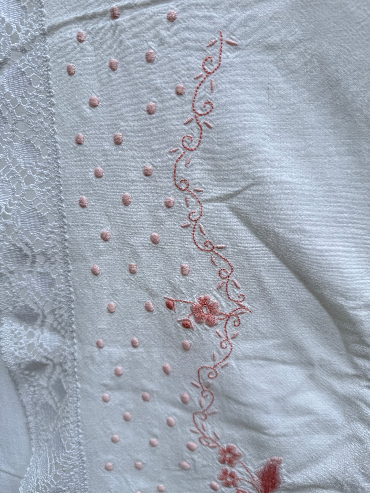 AA. Pink embroidered sheet with crochet trim 63" x 90"