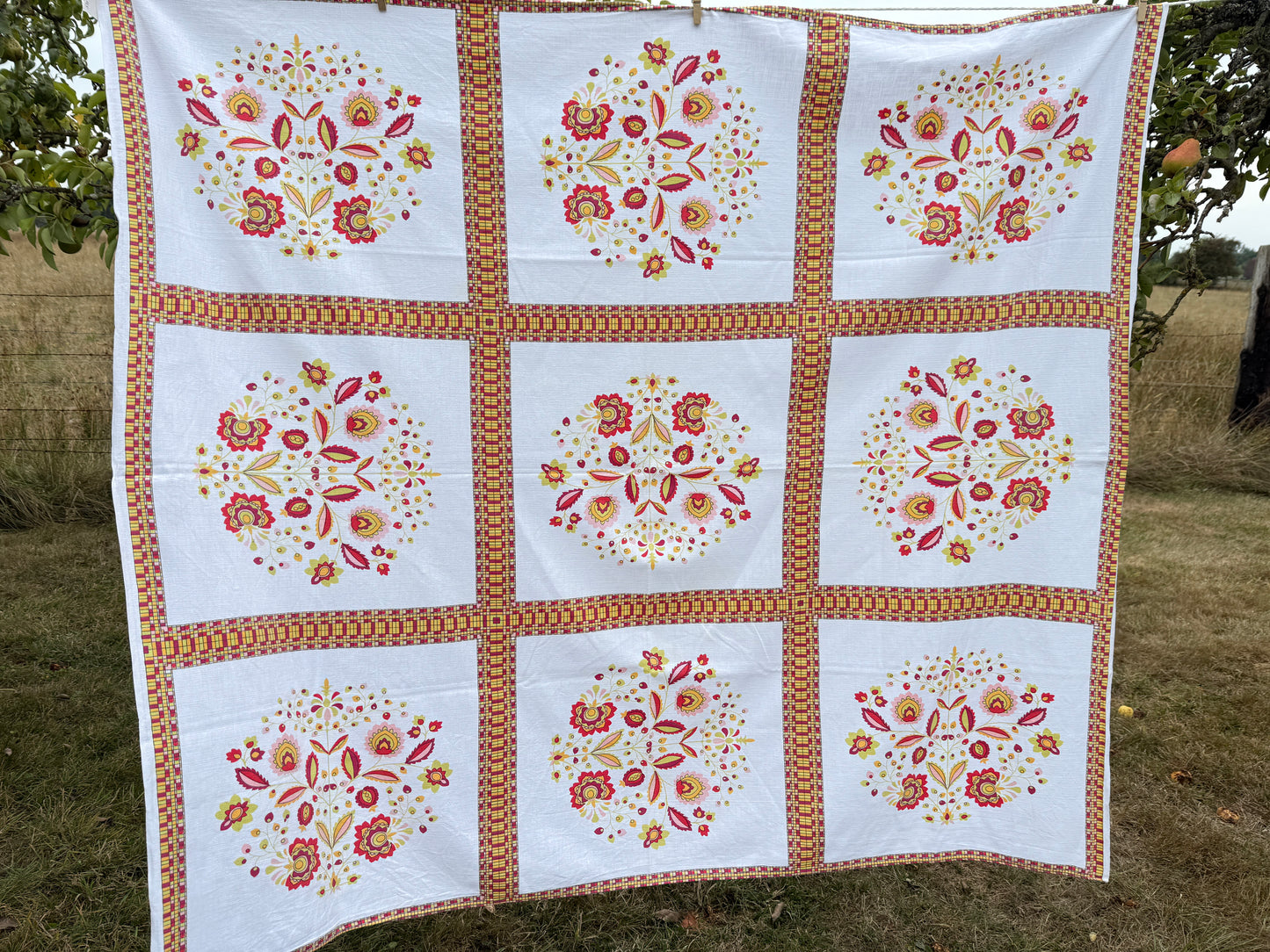 AA. Hot pinks and orange printed 53" x 59"