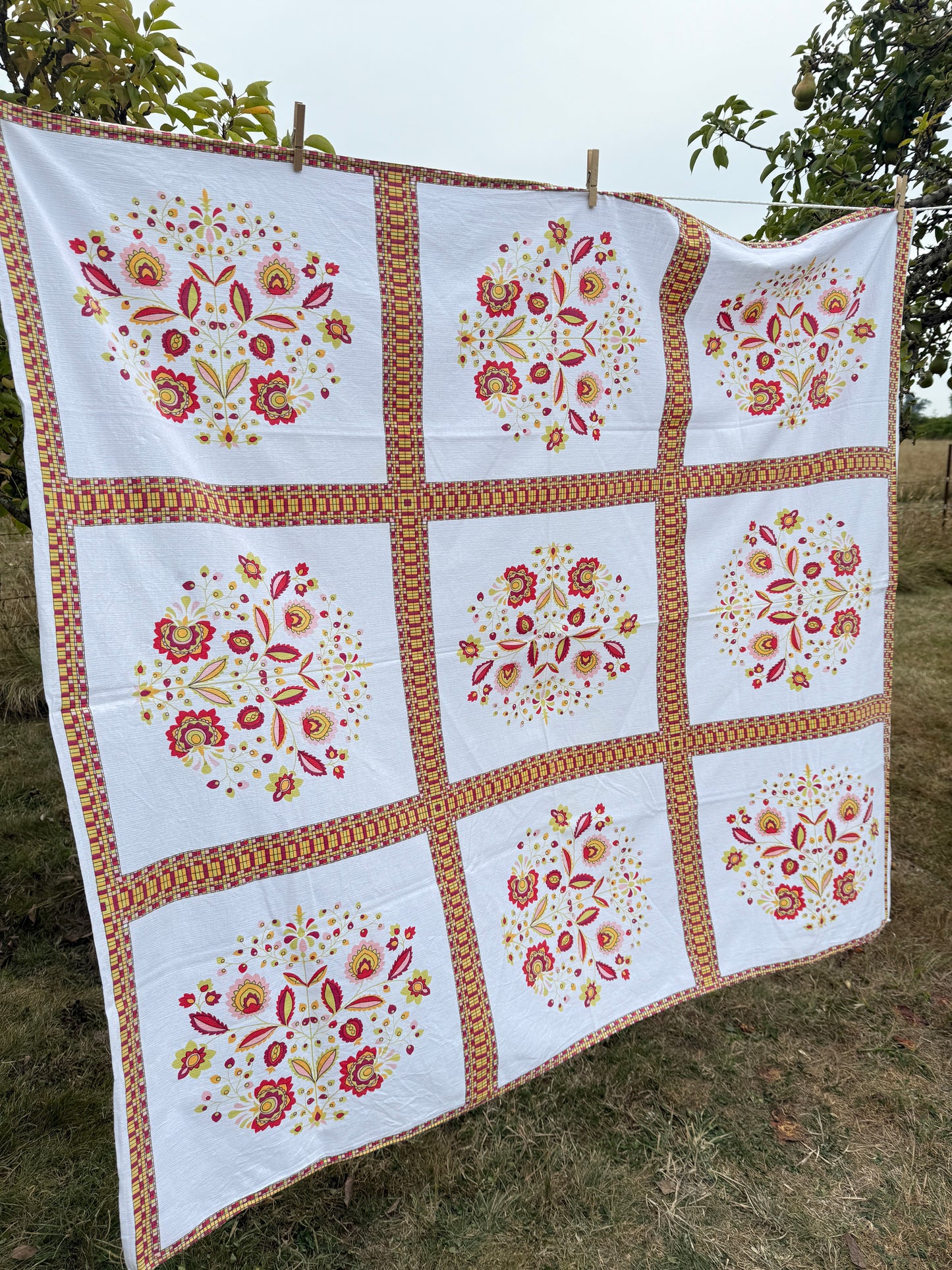 AA. Hot pinks and orange printed 53" x 59"