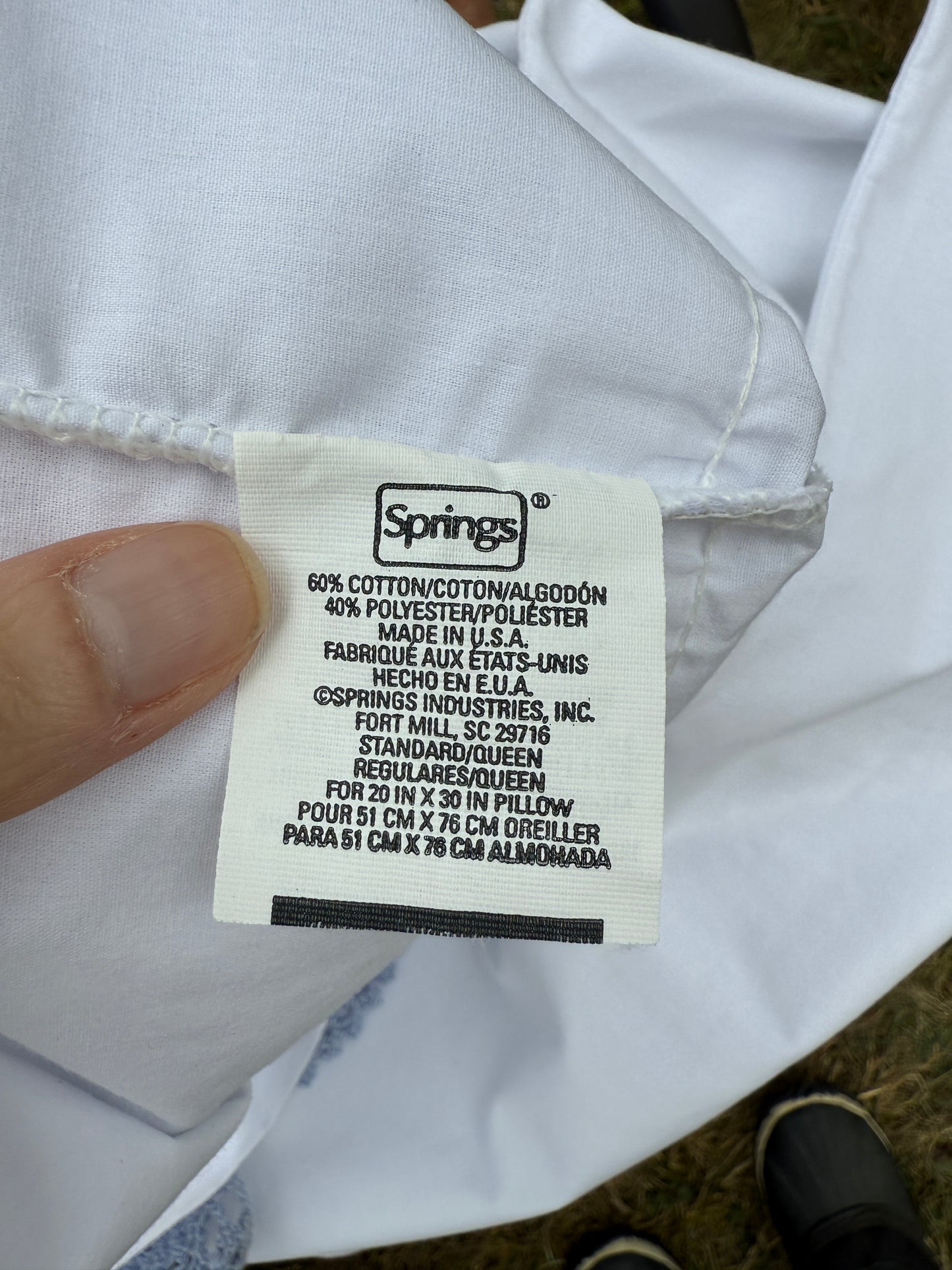 AA. Pair of pillowcases with blue crochet