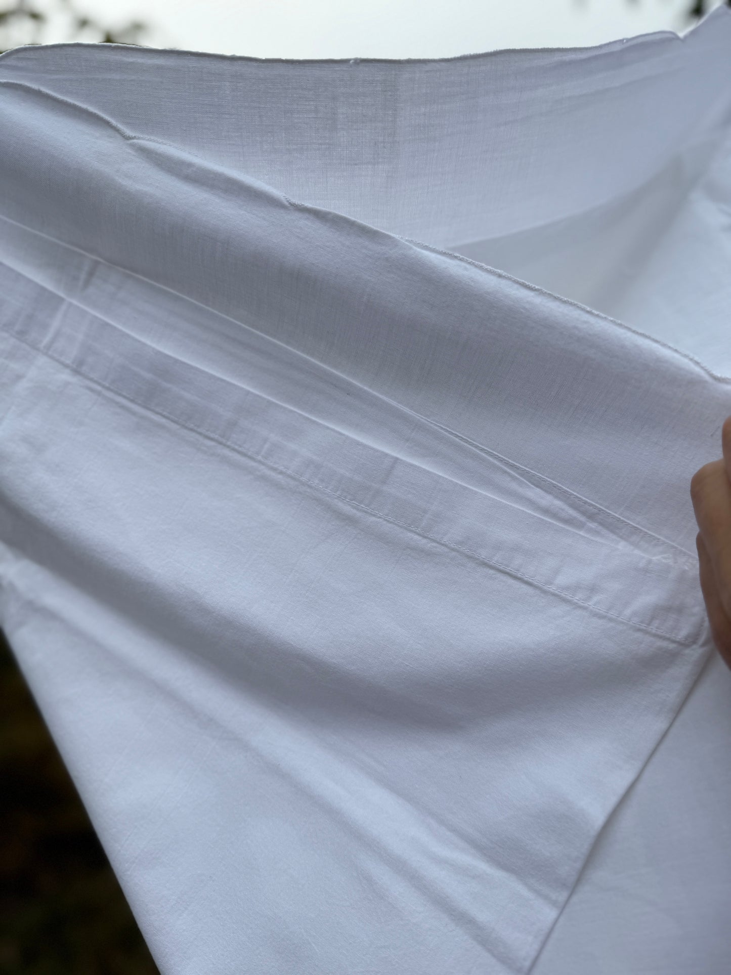 AA. Pair of pillow shams with white embroidery