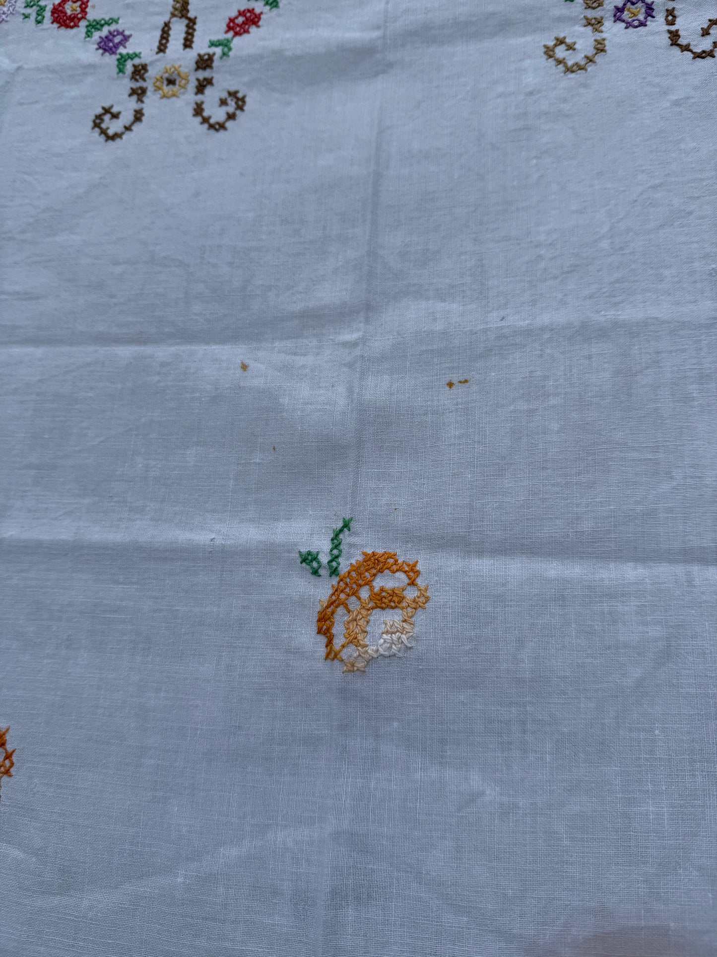 AA.multi colored cross stitch with crochet trim 47"x47"