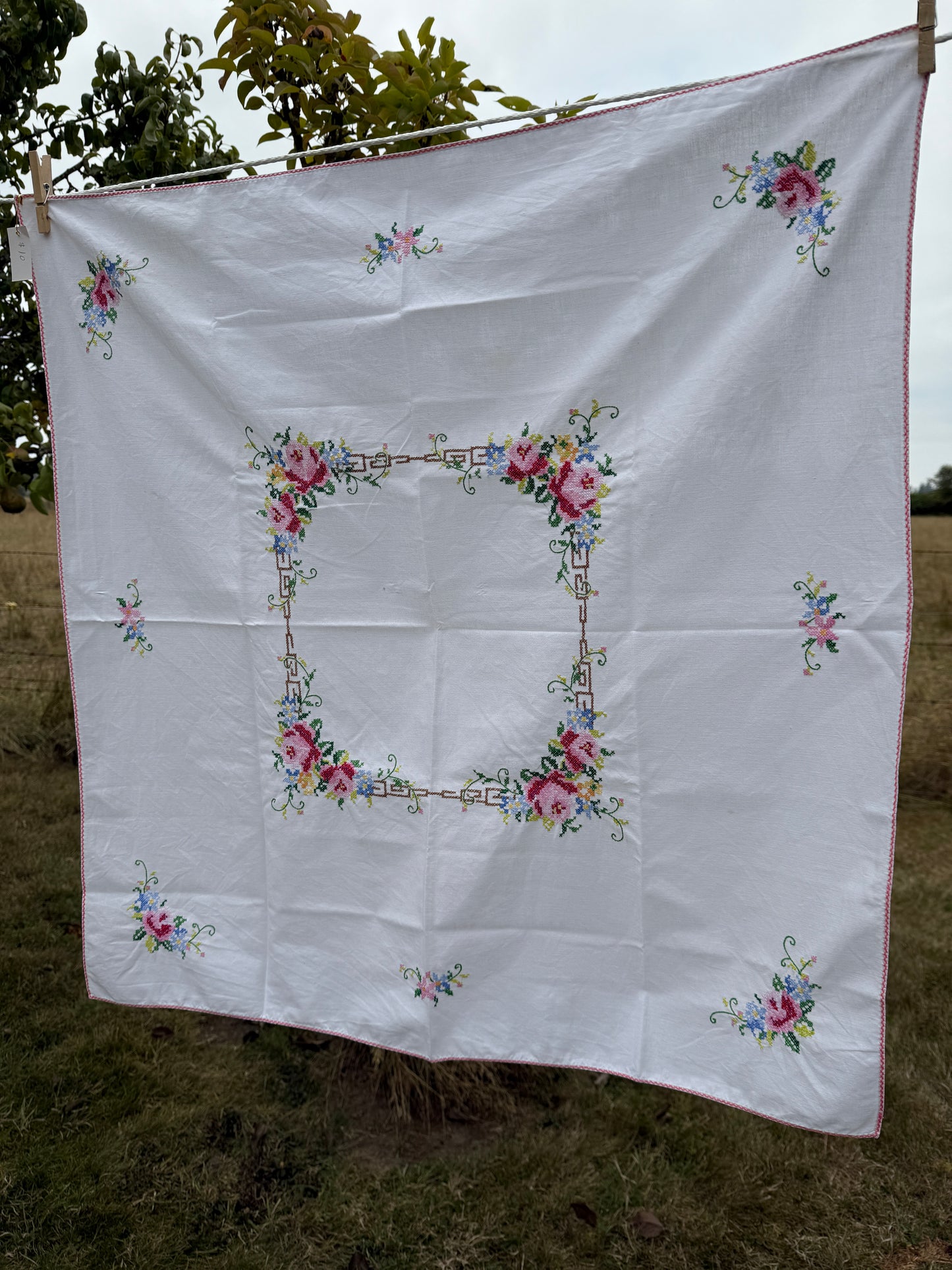 AA.Multi color cross stitch with pink edging 32" x 32"