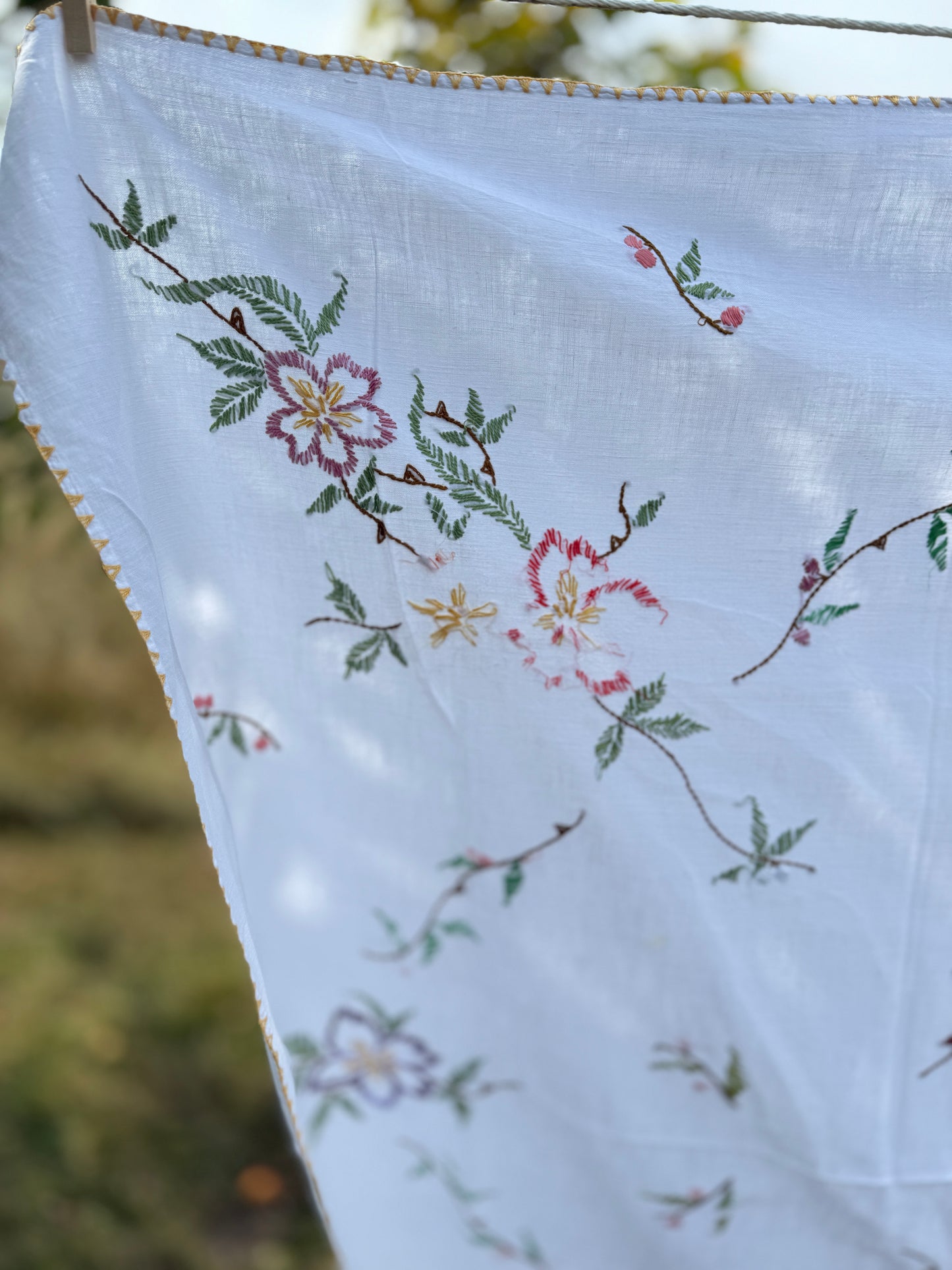 AA. multi colored flowers with yellow blanket stitch 58" x 44"