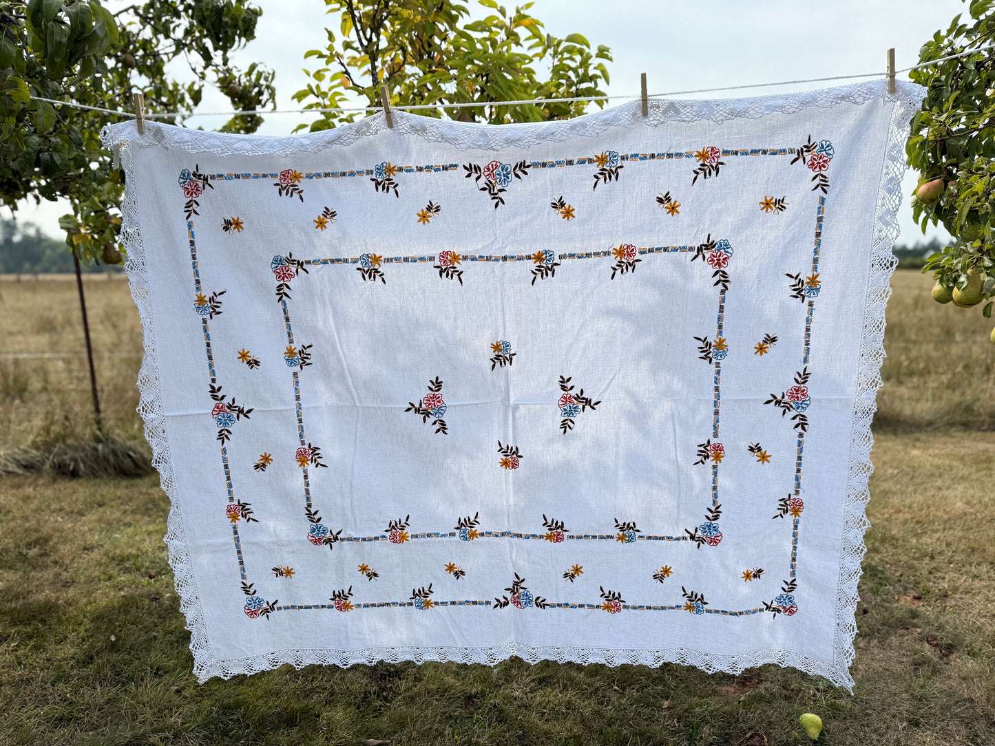 AA. red, blue, orange borders with crochet edging 60" x 51"