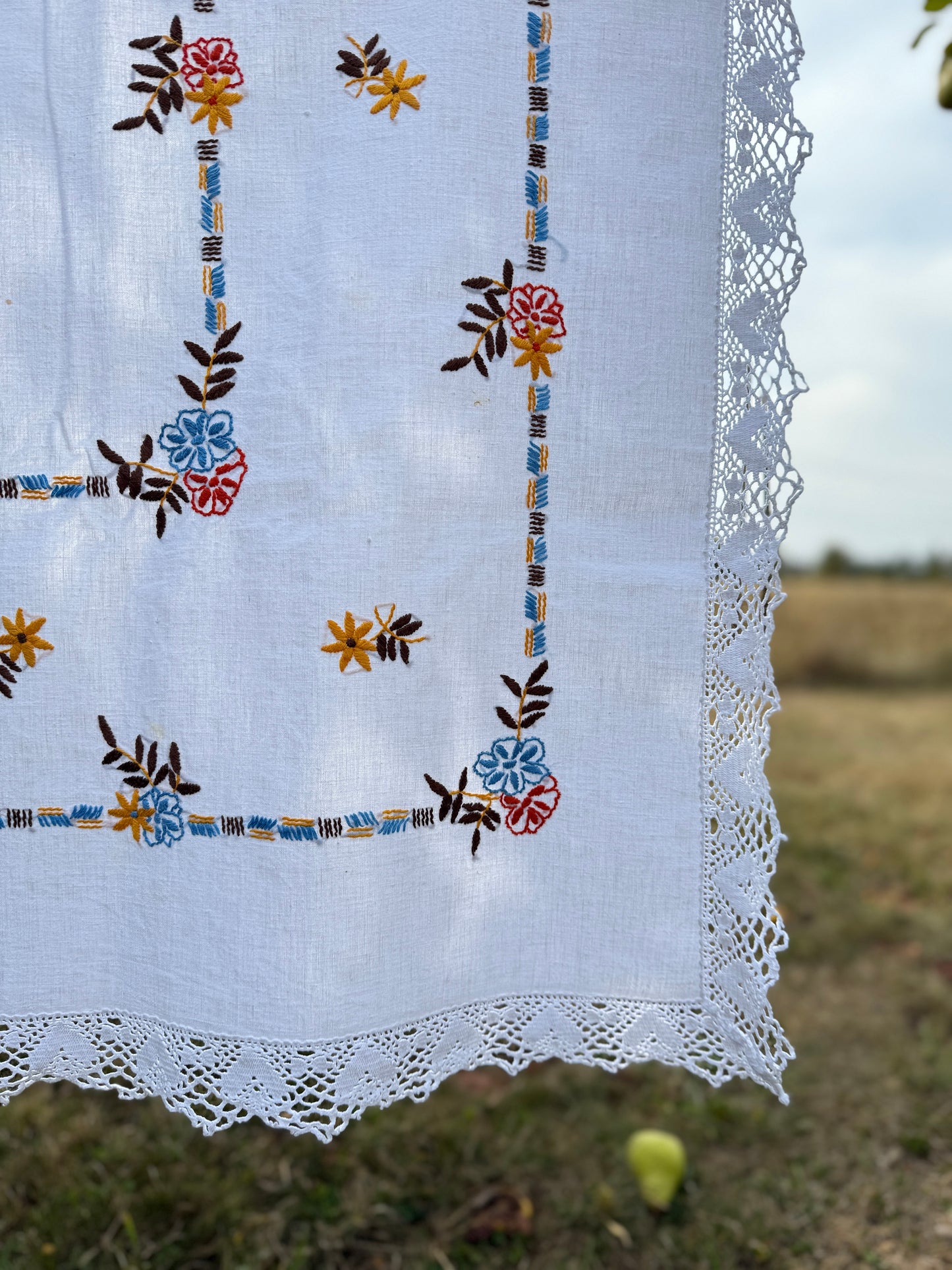 AA. red, blue, orange borders with crochet edging 60" x 51"