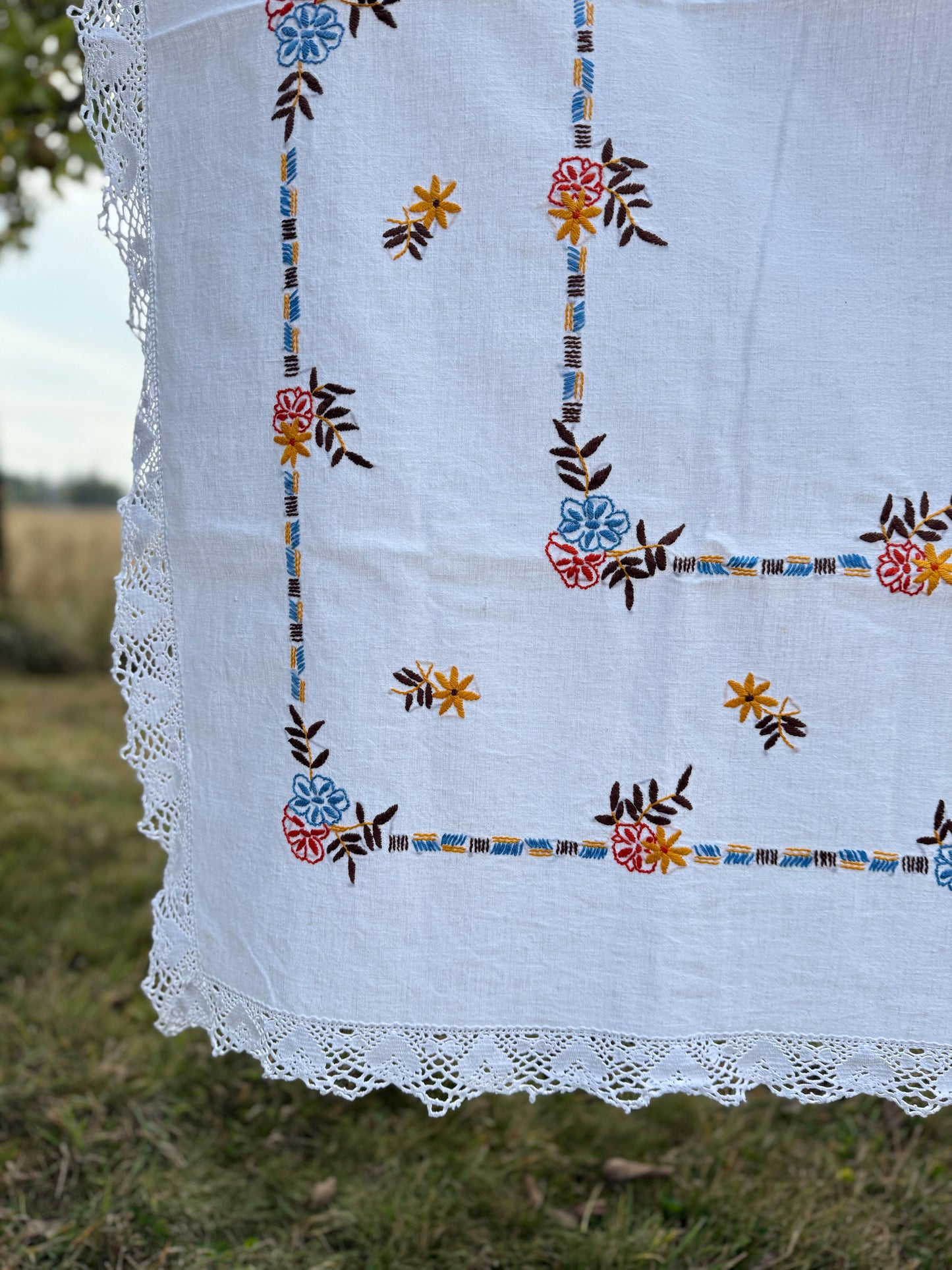 AA. red, blue, orange borders with crochet edging 60" x 51"