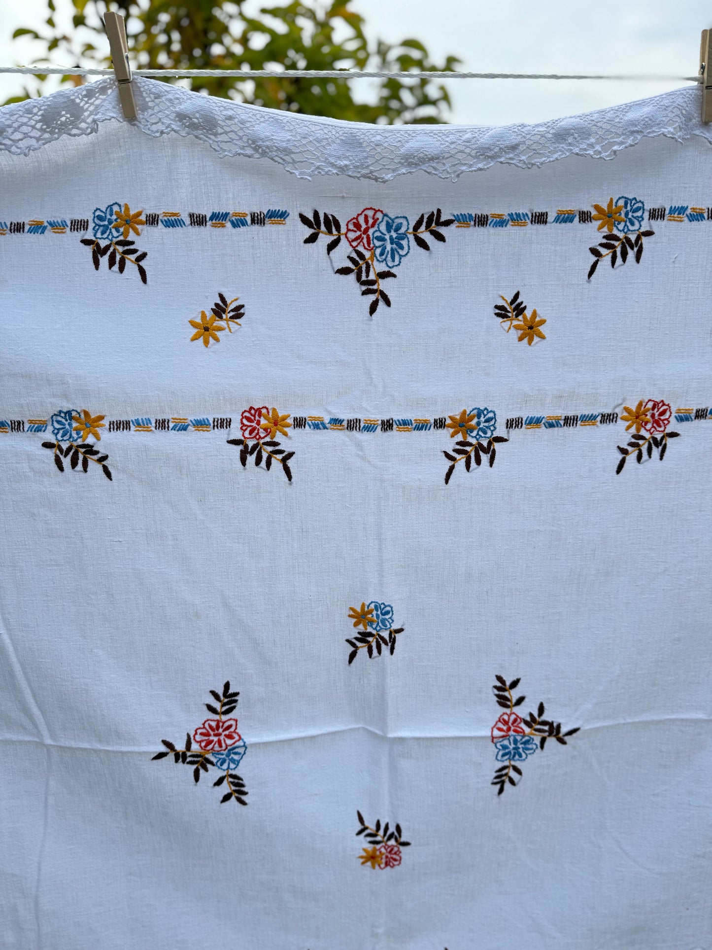 AA. red, blue, orange borders with crochet edging 60" x 51"