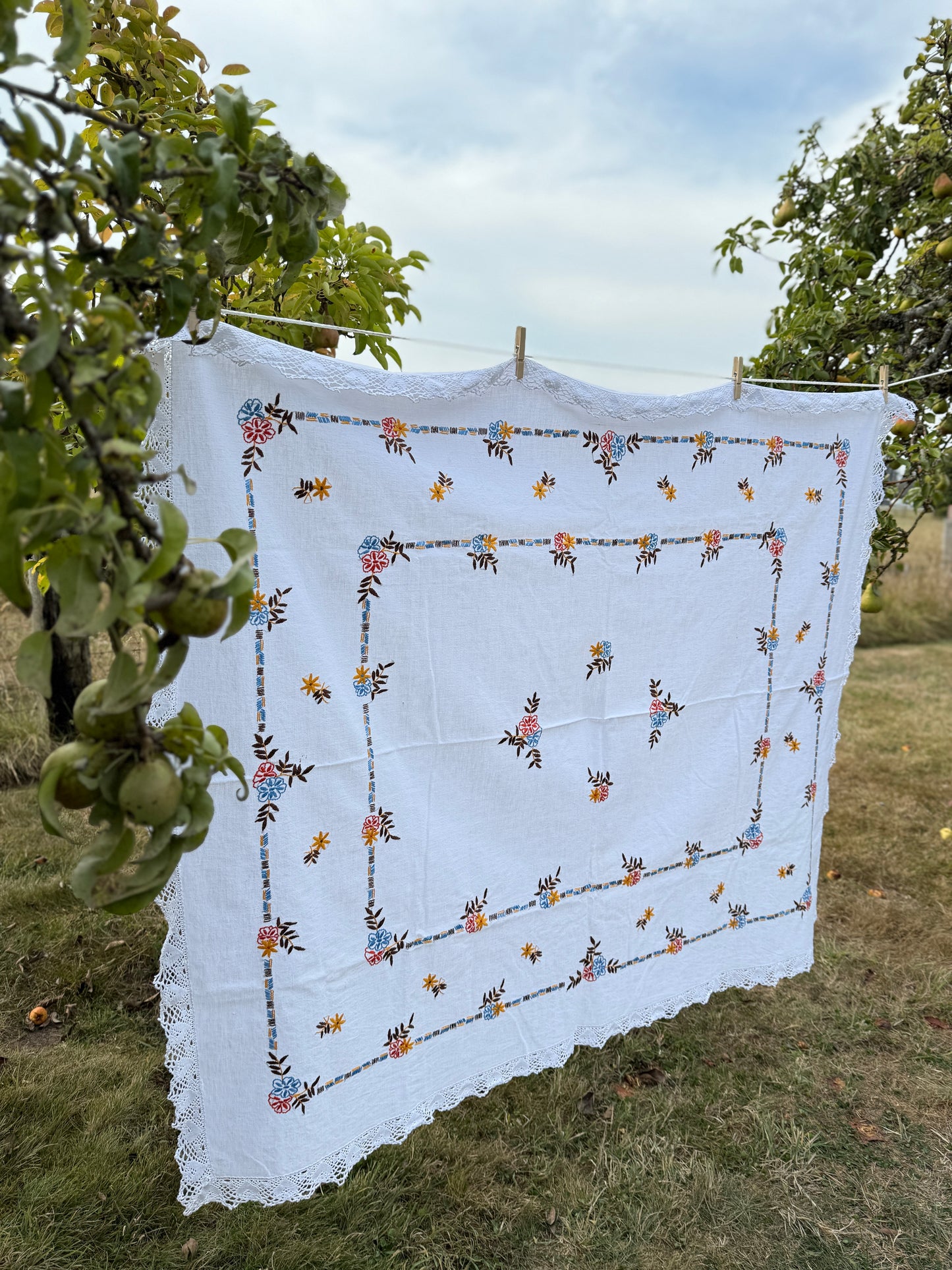 AA. red, blue, orange borders with crochet edging 60" x 51"