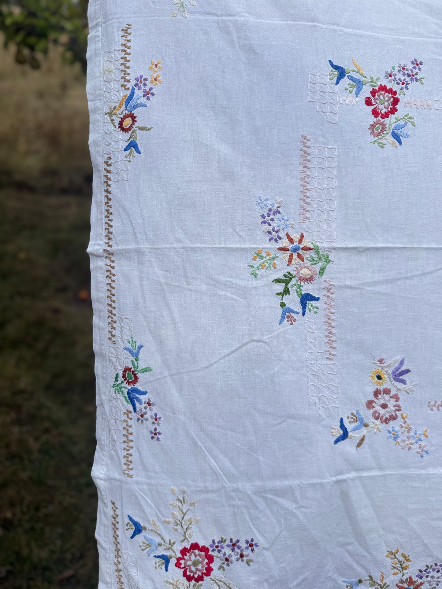 AA. Multi colored embroidered on soft canvas 45" x 52"