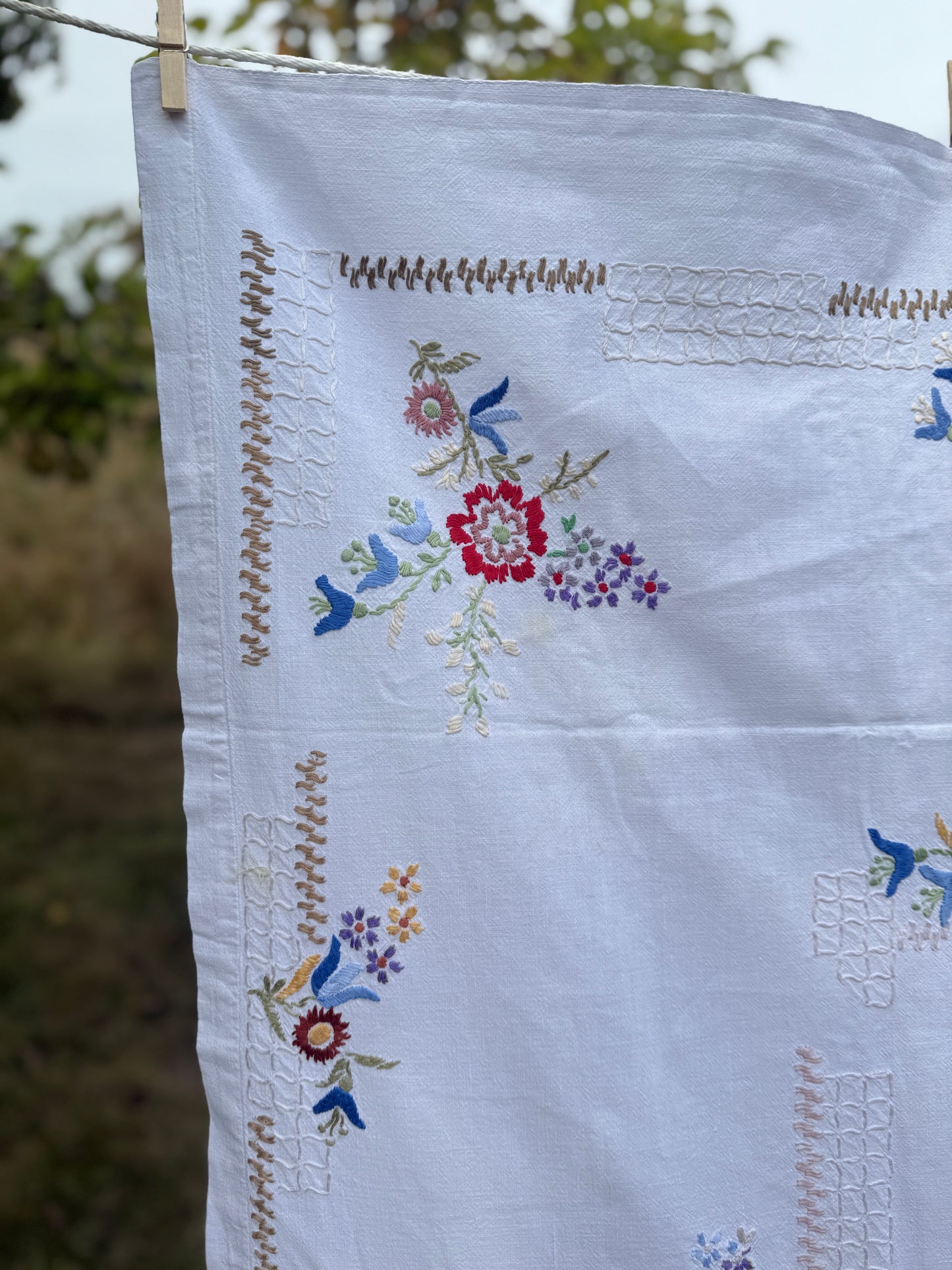 AA. Multi colored embroidered on soft canvas 45" x 52"