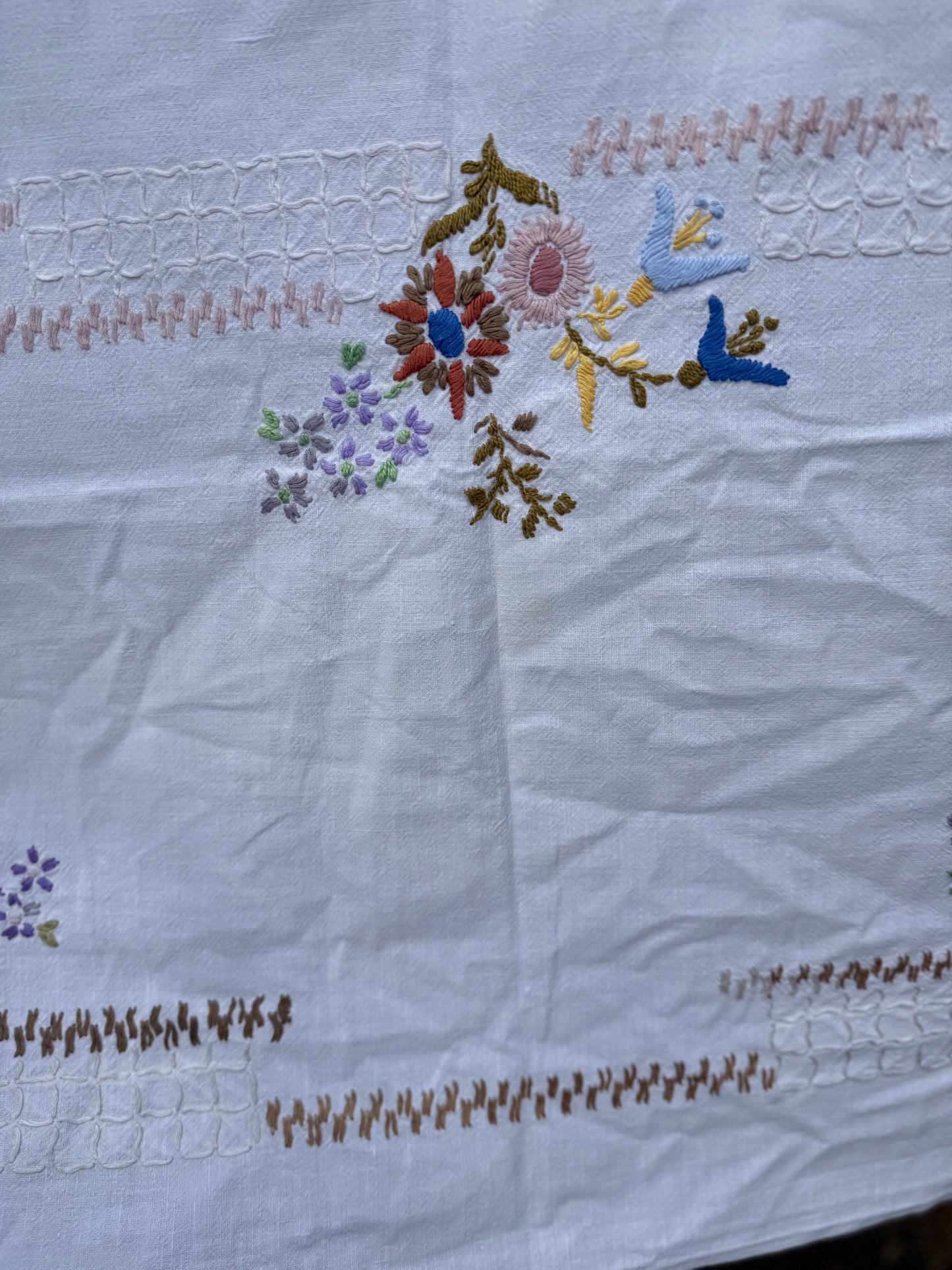 AA. Multi colored embroidered on soft canvas 45" x 52"