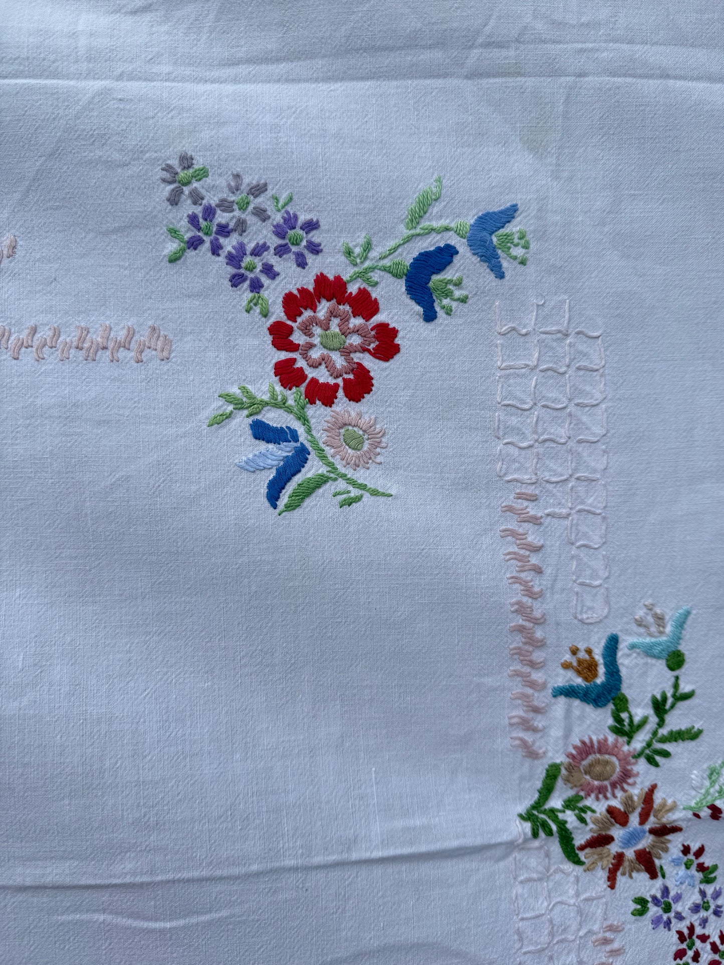 AA. Multi colored embroidered on soft canvas 45" x 52"