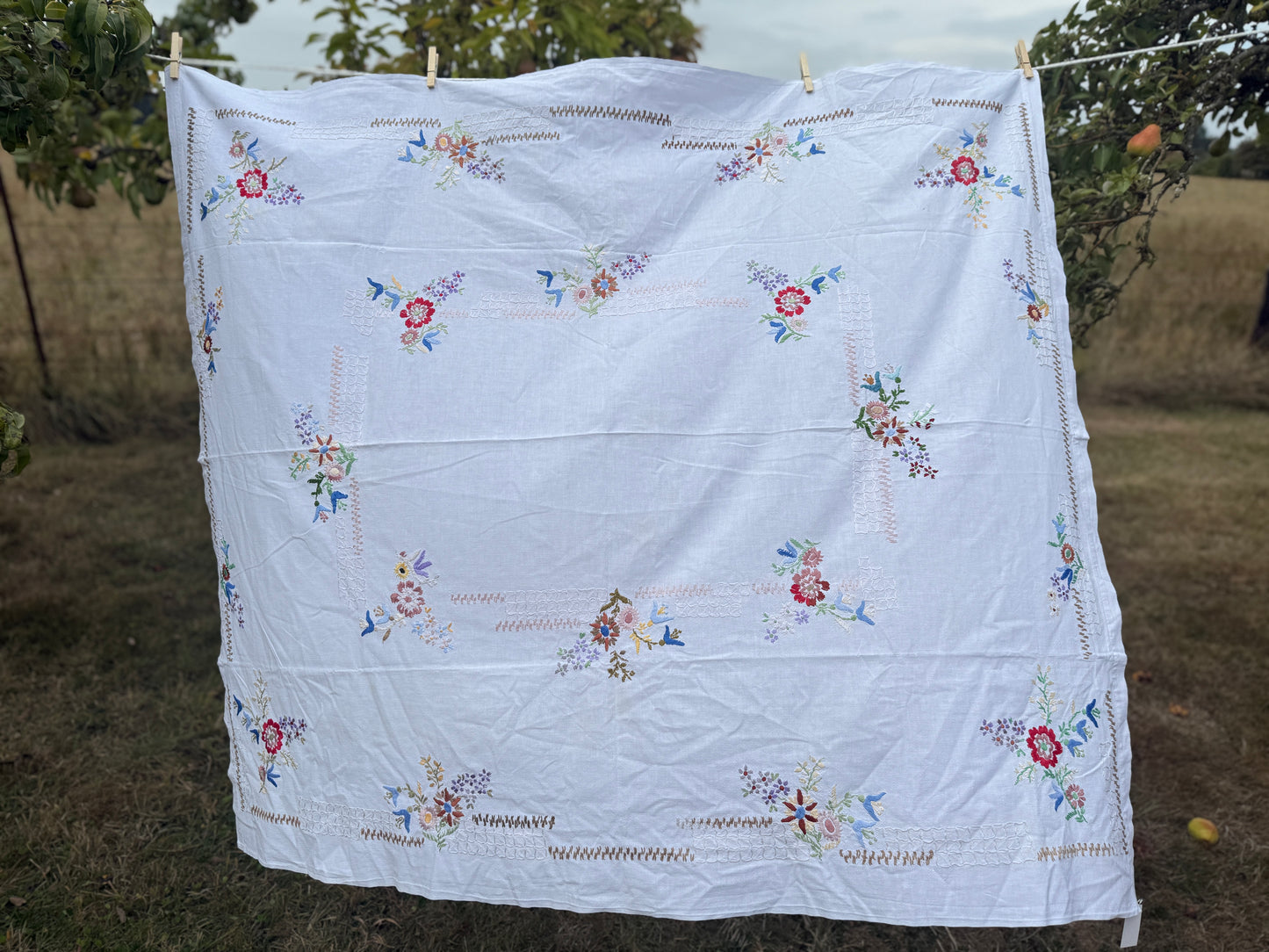 AA. Multi colored embroidered on soft canvas 45" x 52"