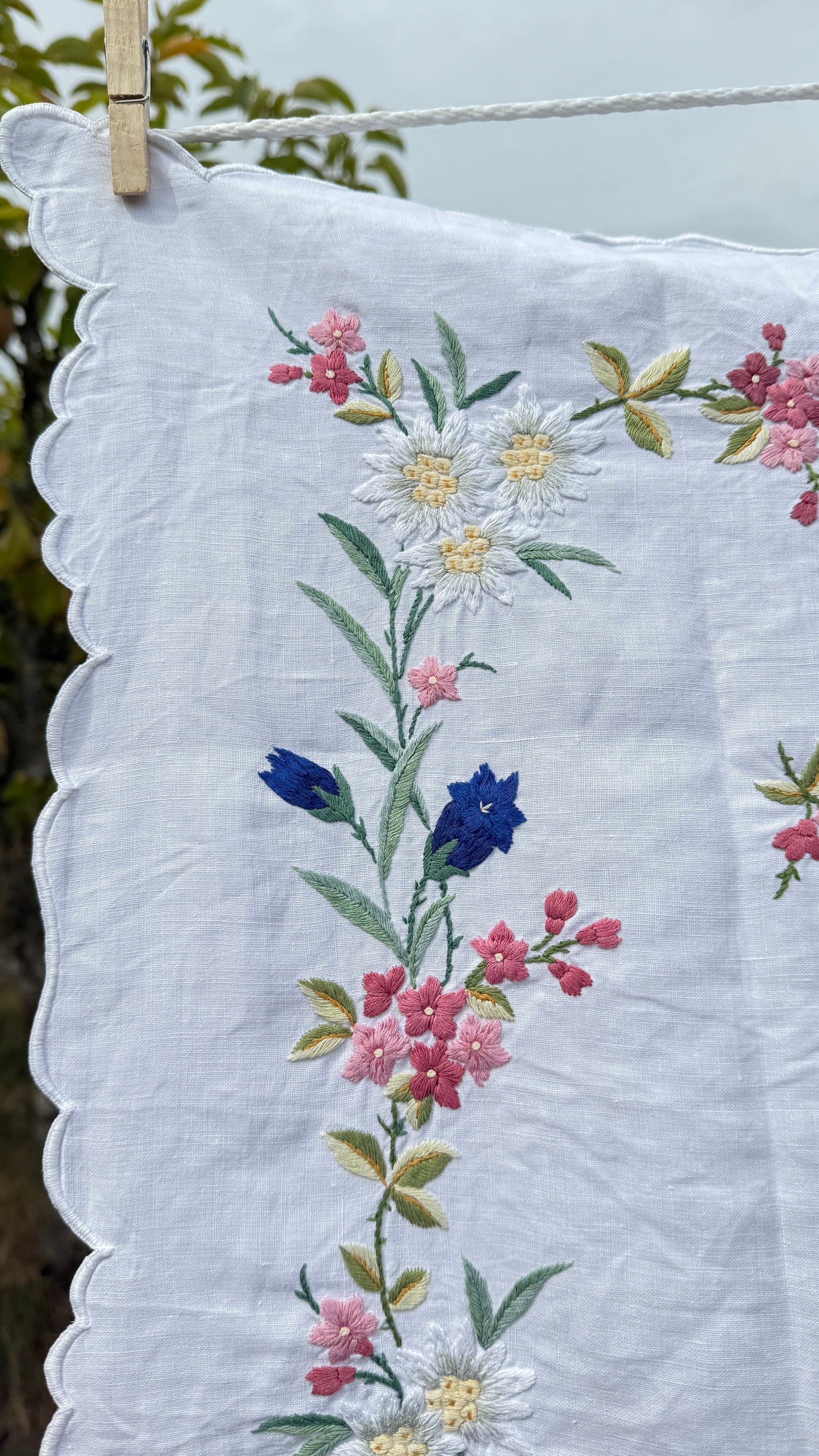 AA. Multi colored embroidered with scallop edges 28" x28"