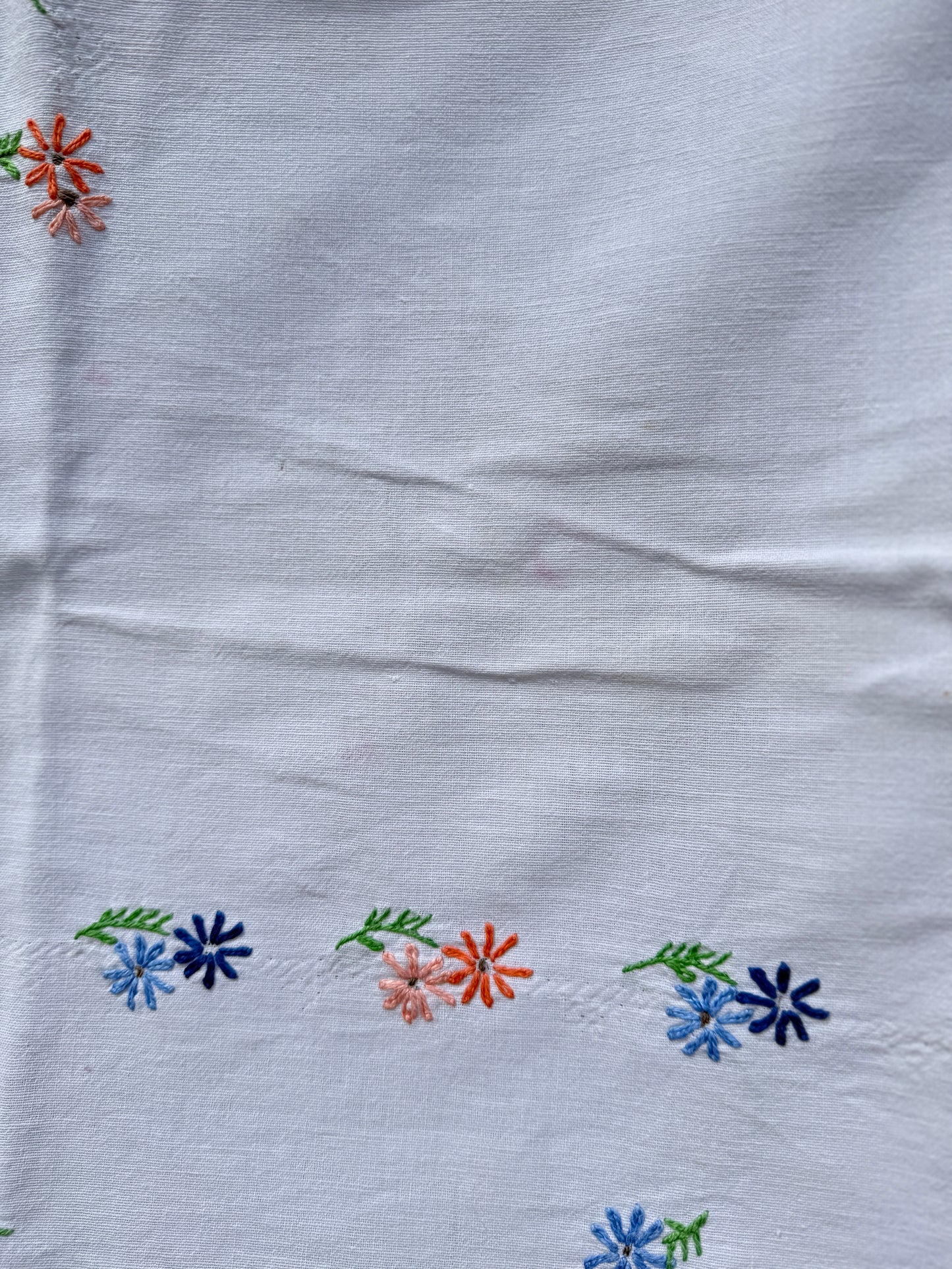 AA. peach and blue daisy embroidered with eyelet 47" x 58"