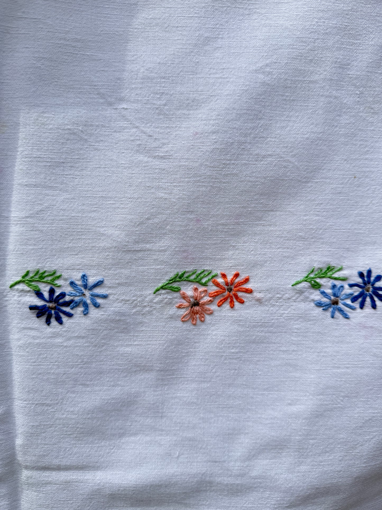 AA. peach and blue daisy embroidered with eyelet 47" x 58"