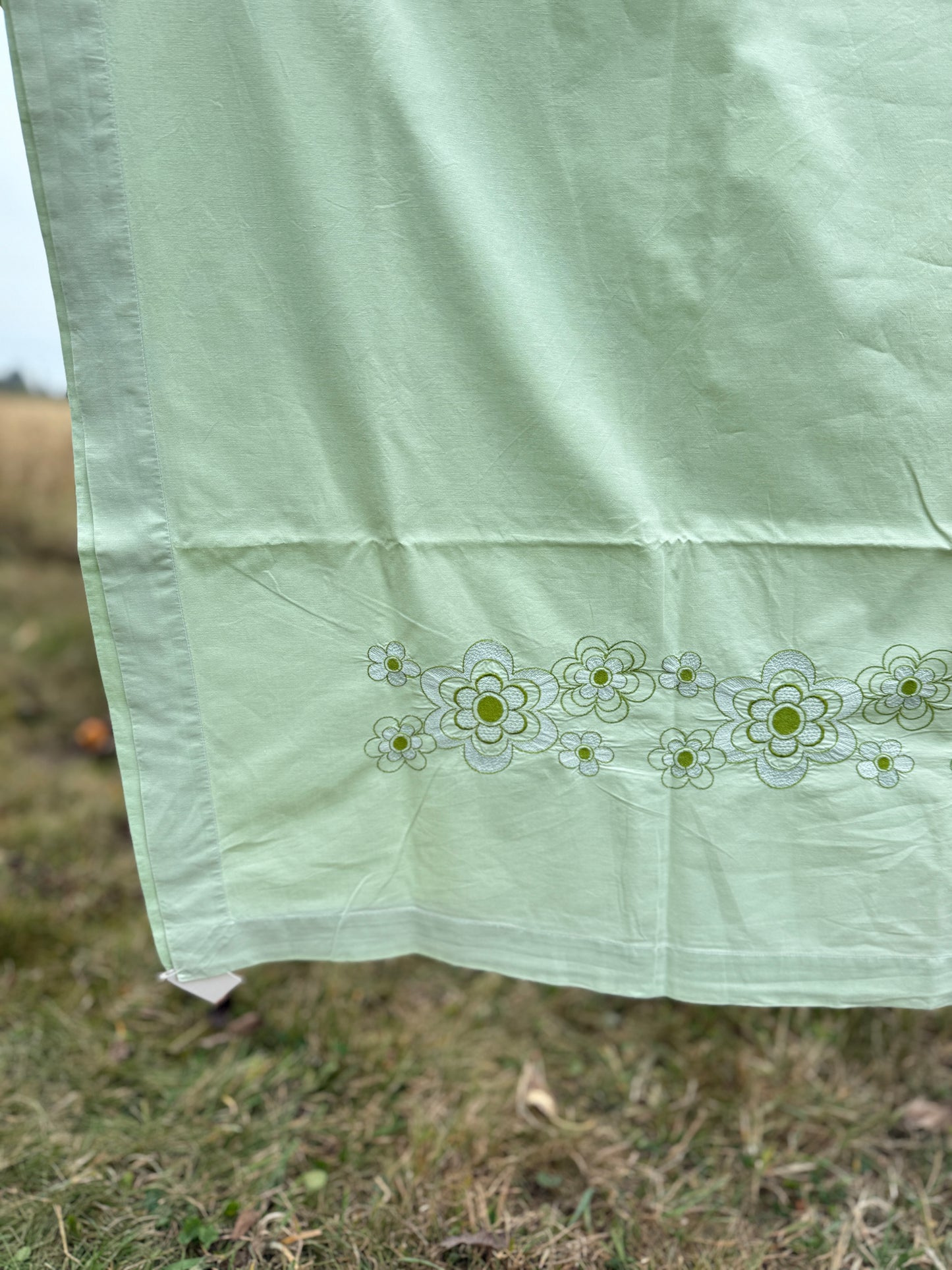AA. Mint green sheet with daisy machine embroidery 55" x 97"