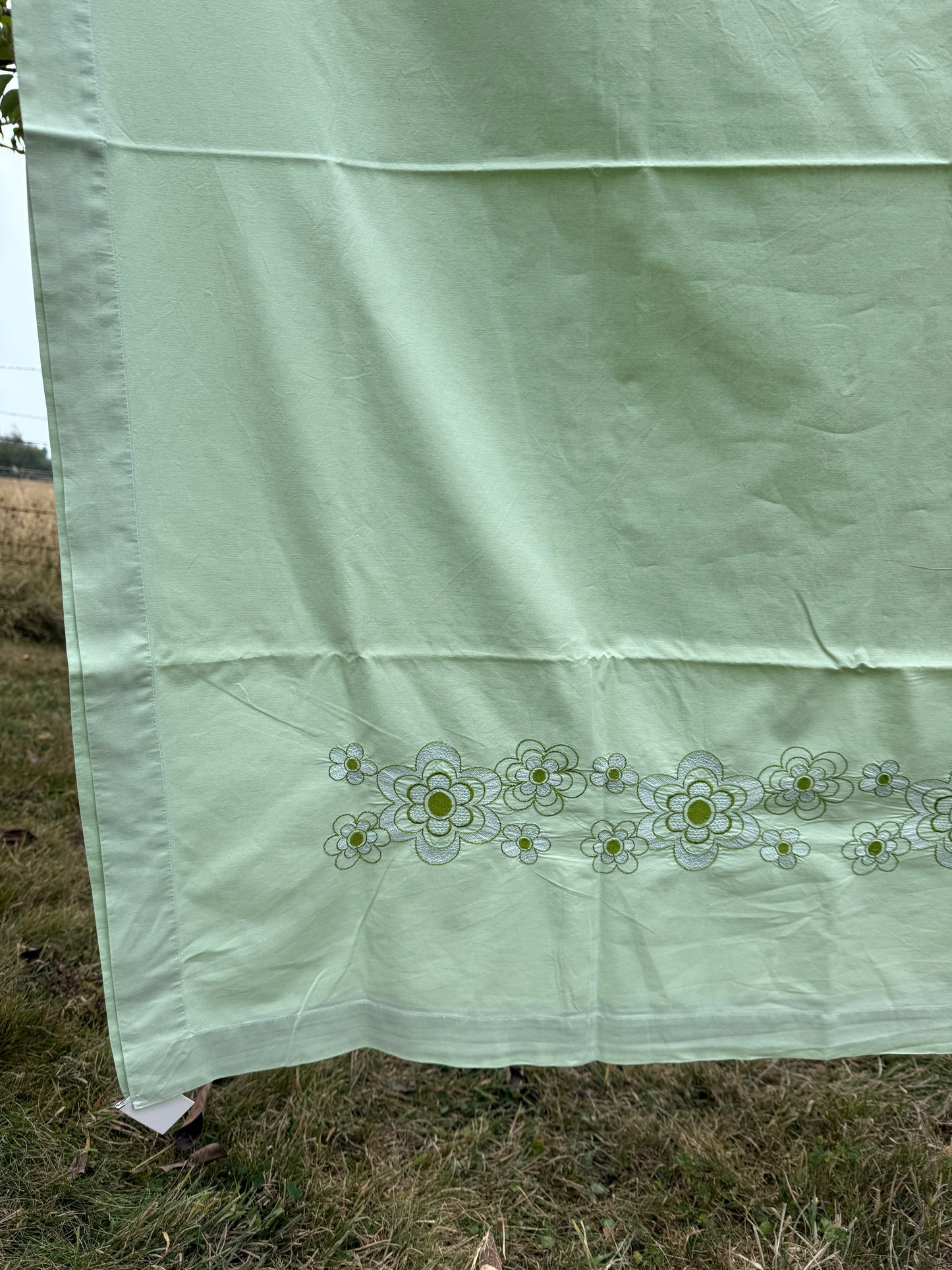 AA. Mint green sheet with daisy machine embroidery 55" x 97"