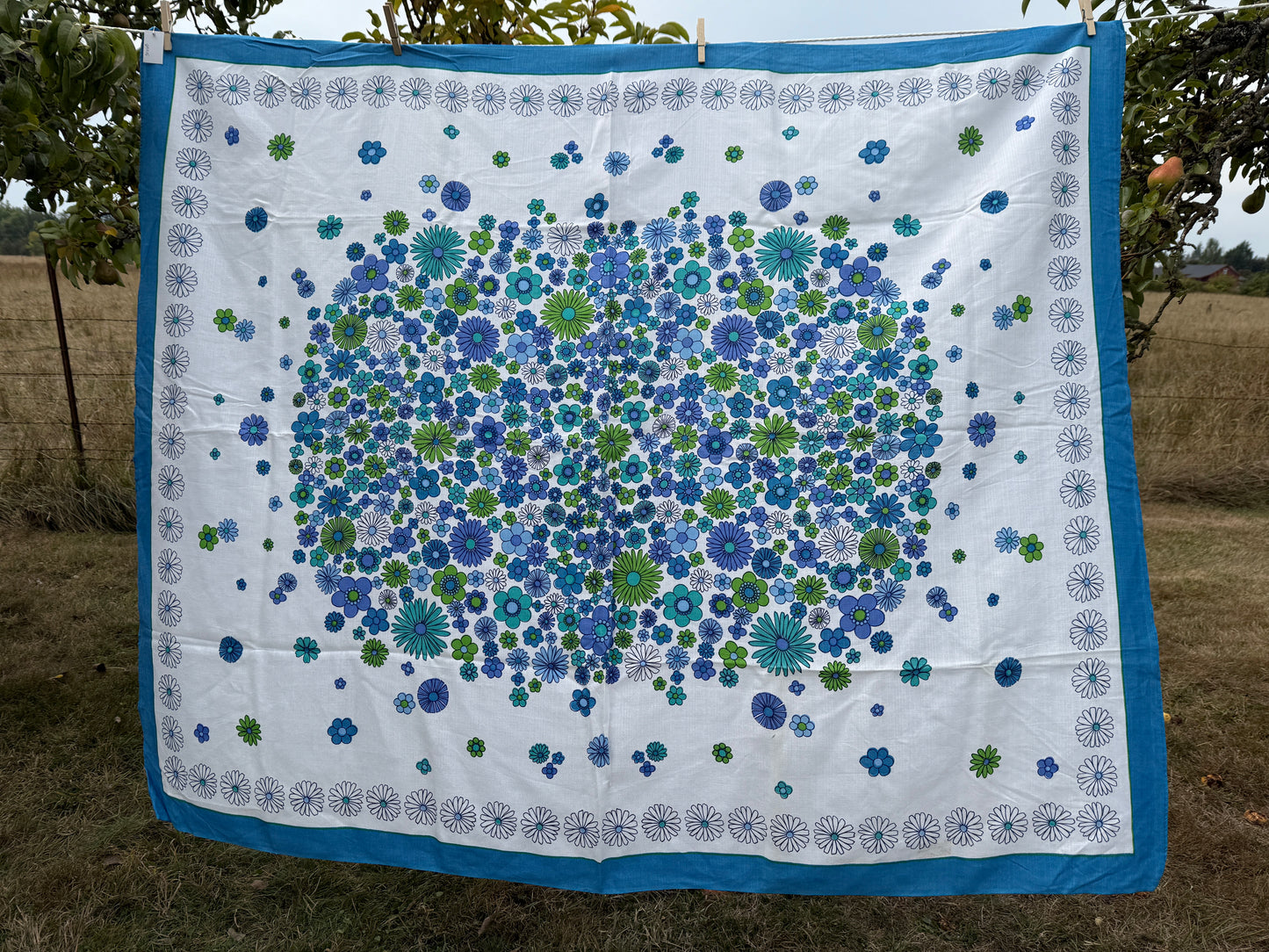 AA. Blues and greens daisy printed 50" x 60"