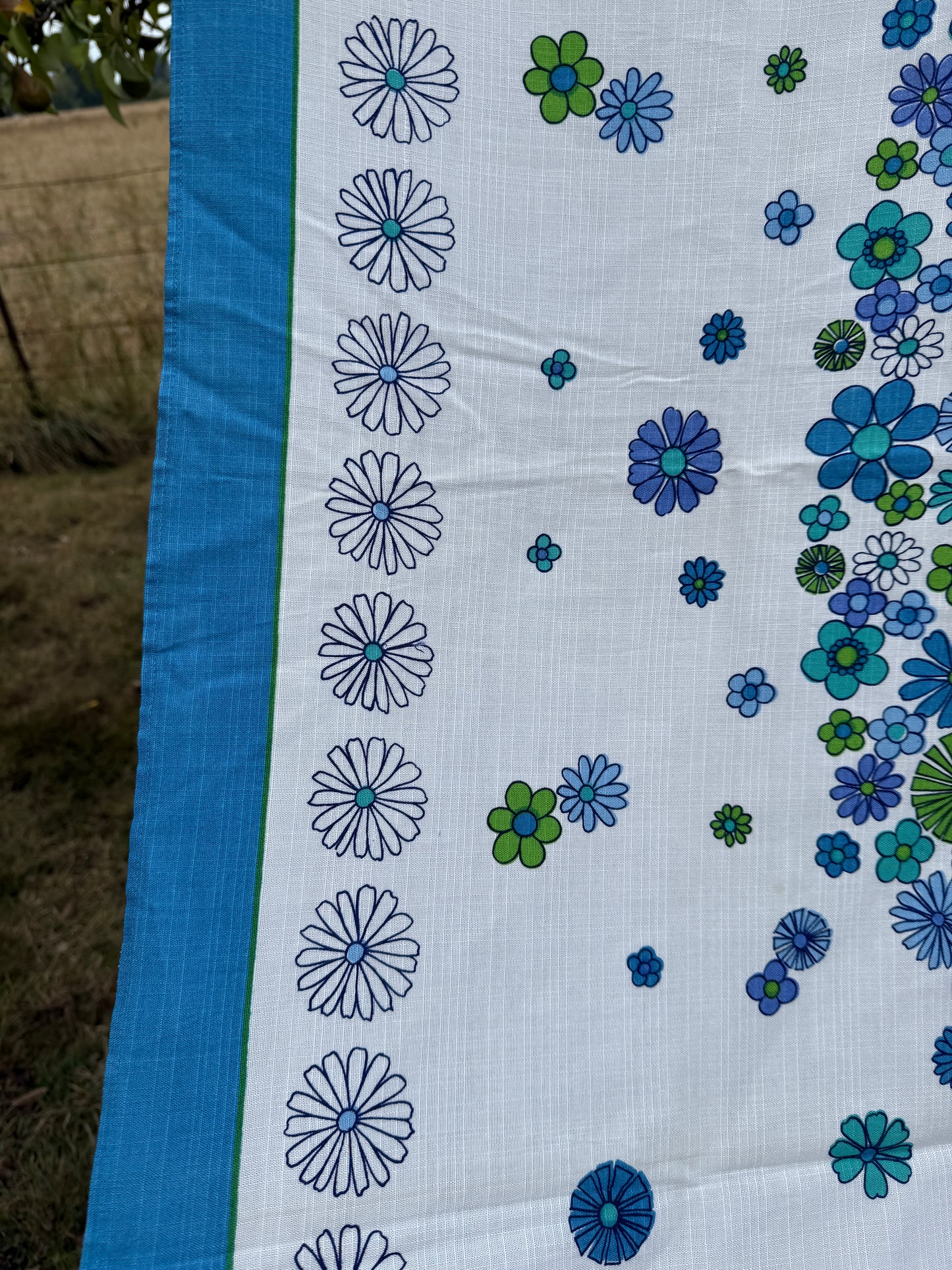 AA. Blues and greens daisy printed 50" x 60"