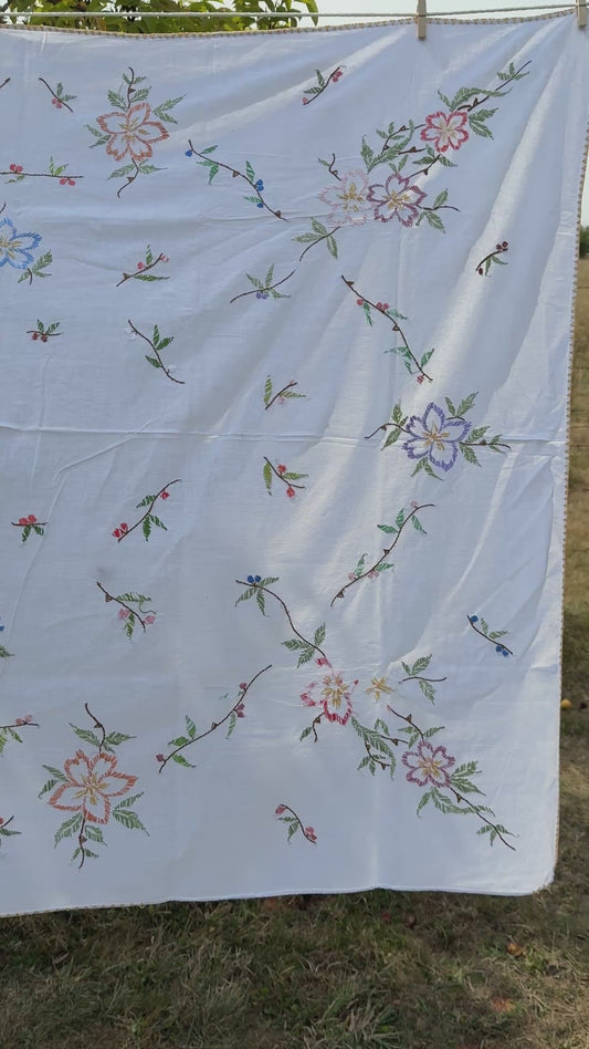 AA. multi colored flowers with yellow blanket stitch 58" x 44"